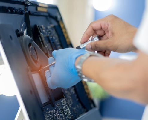 Person repairing medical machinery