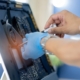 Person repairing medical machinery