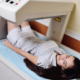 girl on examination in a modern clinic by densitometry