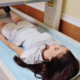 girl on examination in a modern clinic by densitometry - checking the density of bone tissue